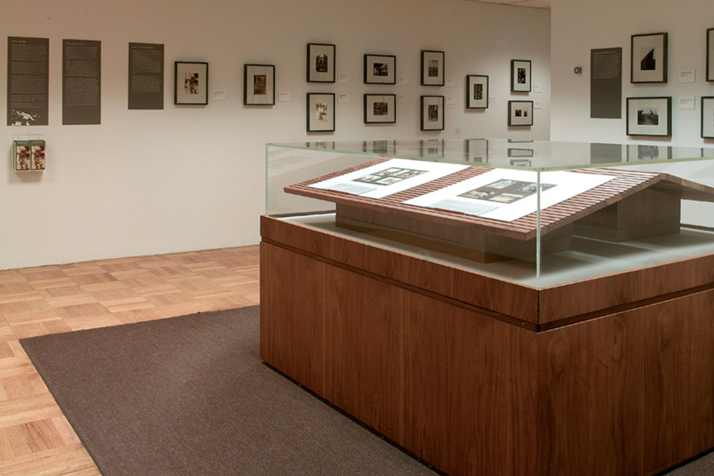 A wooden or bronze slab showcases an amalgam of figures en relief